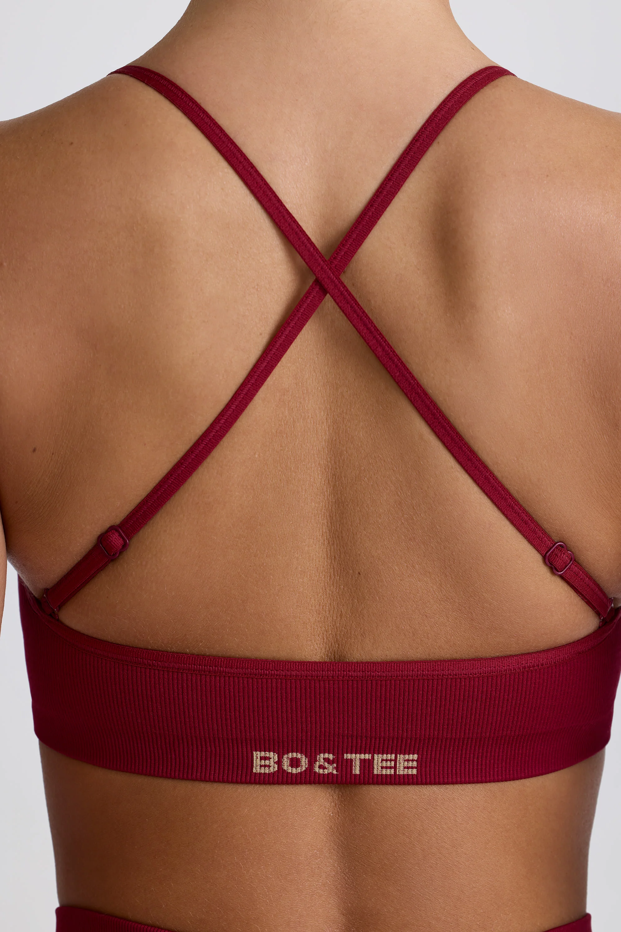 Super Sculpt Seamless Cross-Back Sports Bra in Burgundy - Image 6
